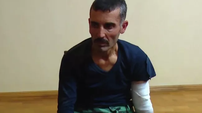 Взятый в плен сириец, который участвовал в боевых действиях на стороне Азербайджана. Стоп-кадр видео